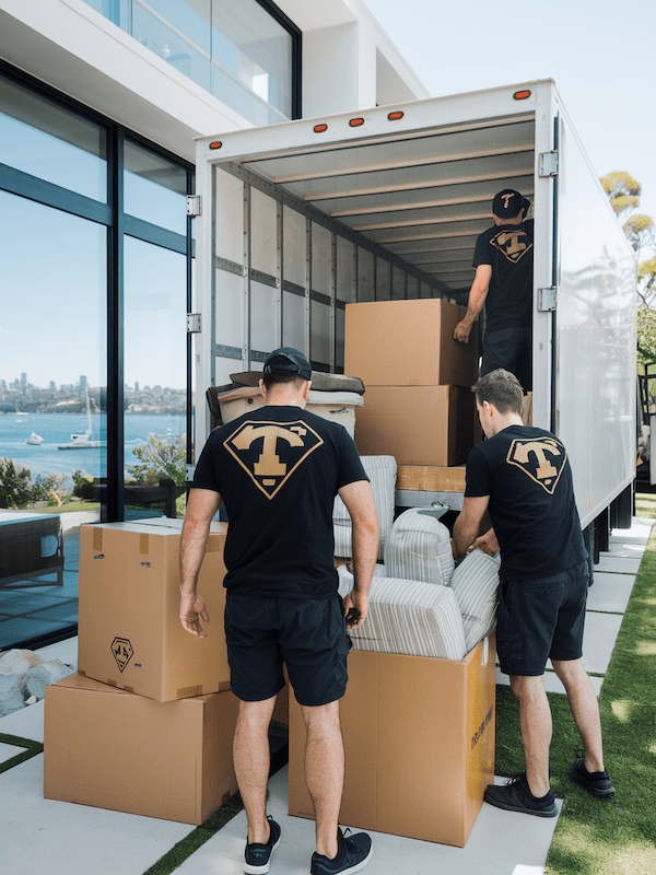moving-company-north-shore Removalists load boxes into a truck from a moving company North Shore of Sydney